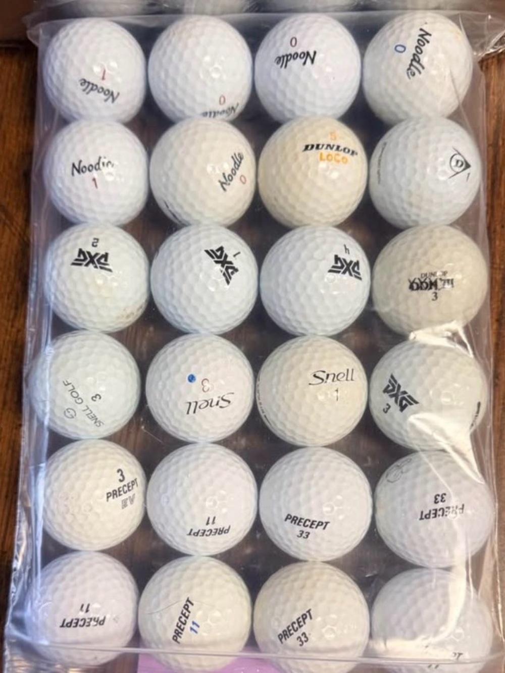 24 mixed golf balls Percept, Noodle, PXG, Snell, and Dunlop. Good used condition